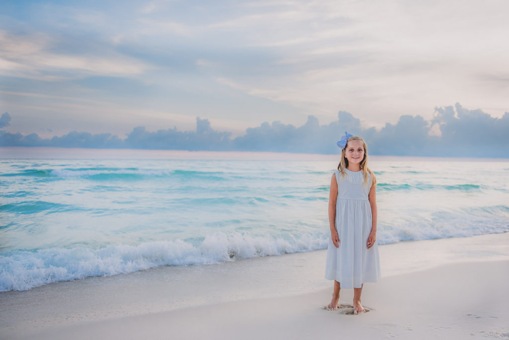 beautiful portrait of a young girl with the ocean background