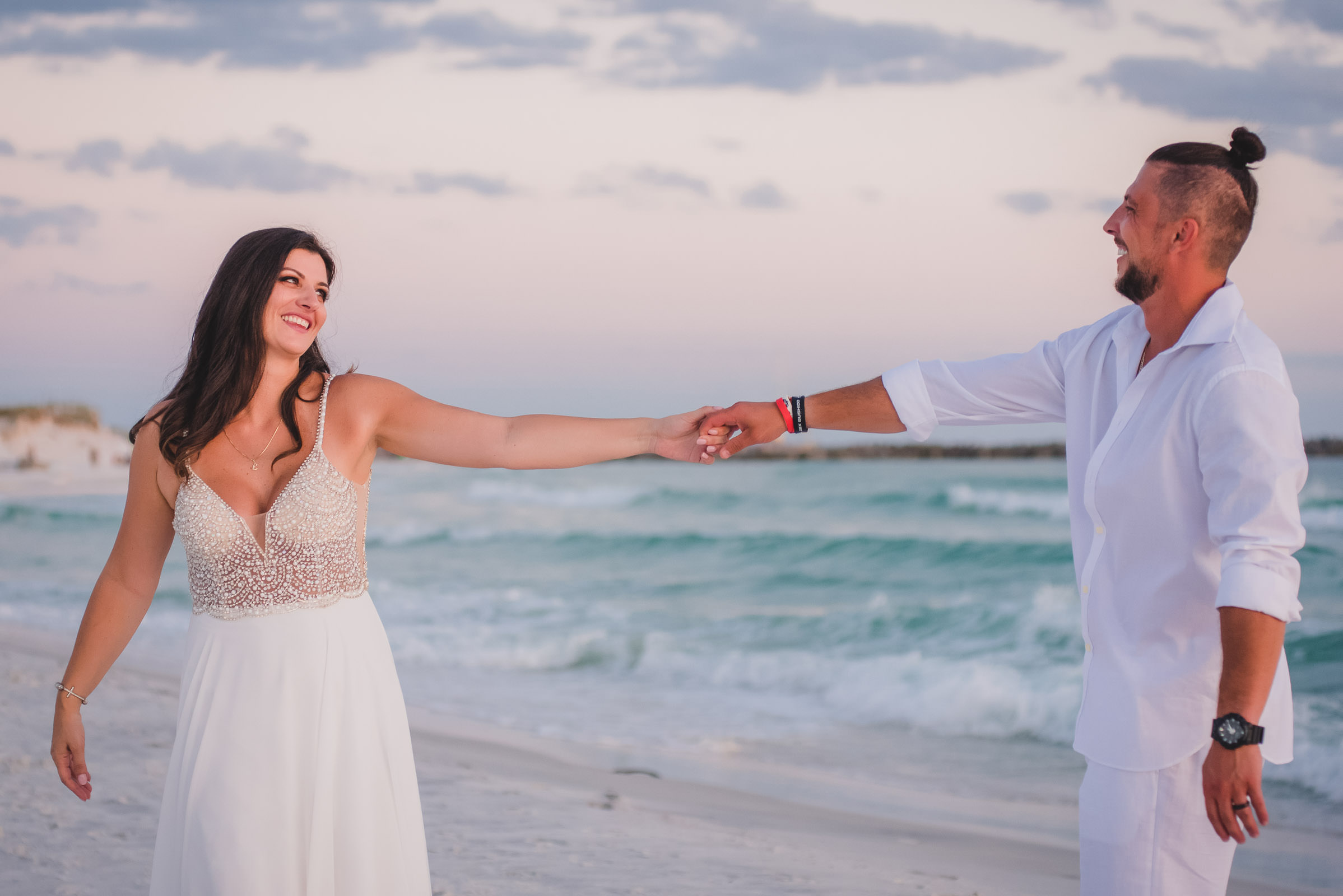 bride and groom having fun at Lido Beach