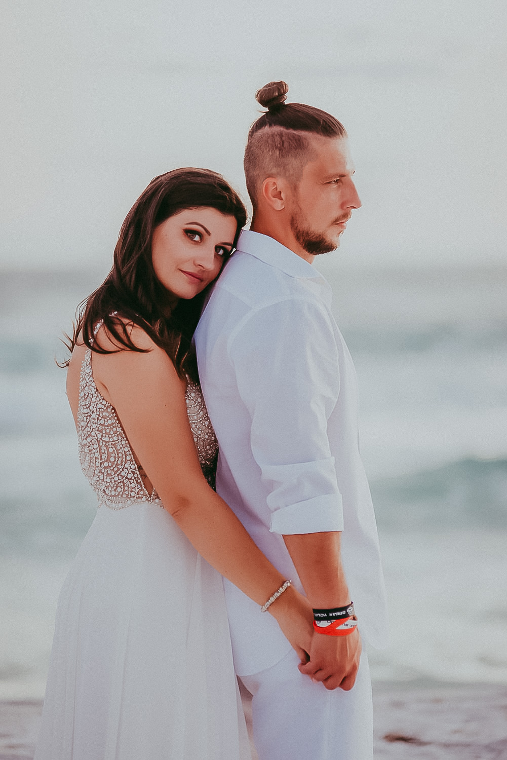 bride and groom romantic pose at the Lido beach