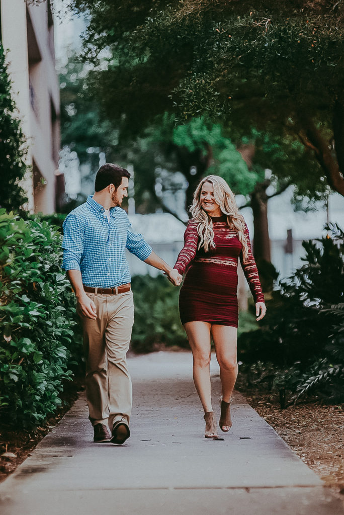 Engagement couple walking in downtown Sarasota