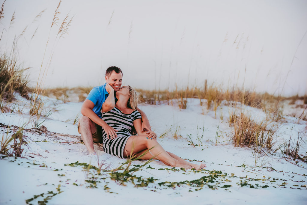 couple in love posing at the white sand beach