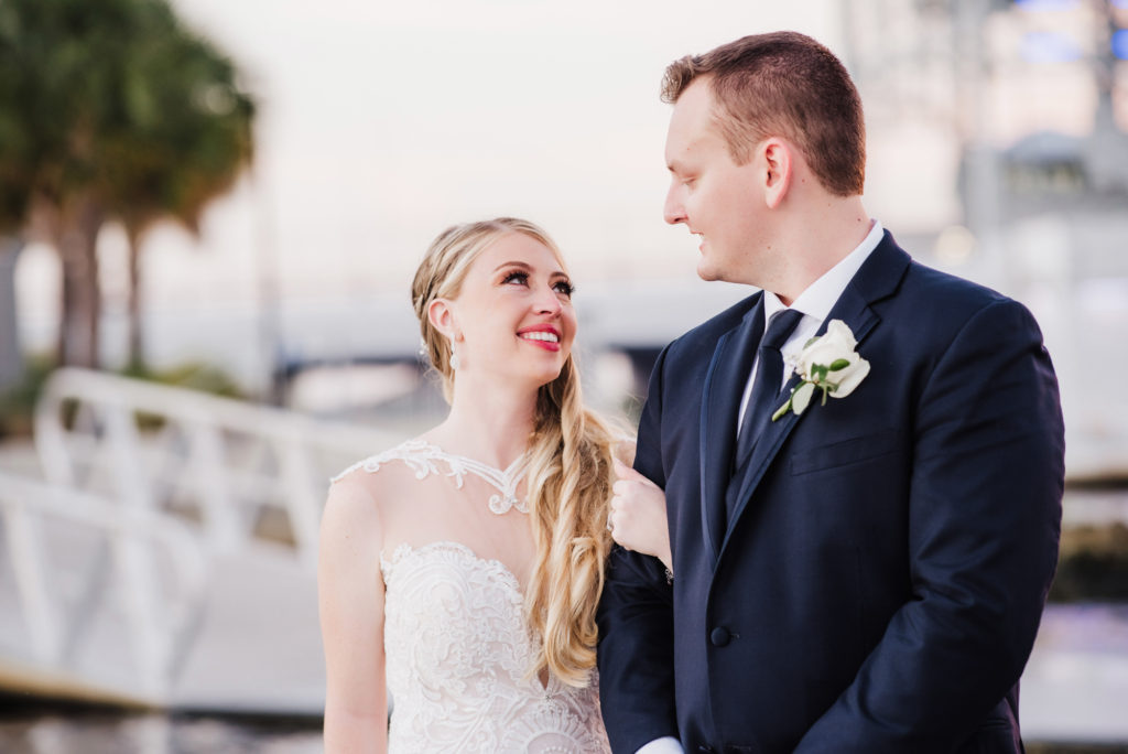 portrait of the bride and groom during sunset at river side