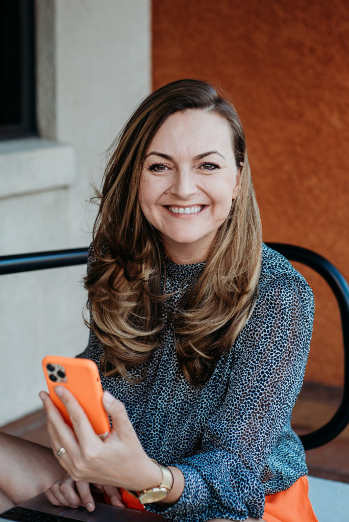 lifestyle portrait of  smiling women with the phone