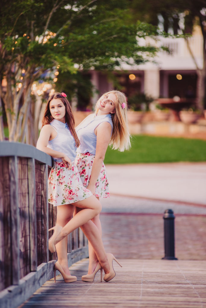 two high school friends posing together at Waterside in Lakewood Ranch location