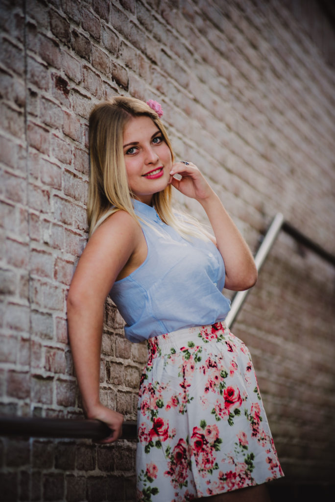 Close up portrait of high school senior in urban location