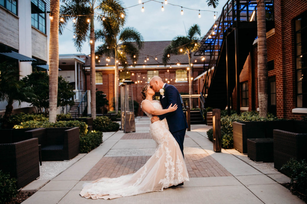 a couple how decided to get married at Armature Works in Tampa share a kiss