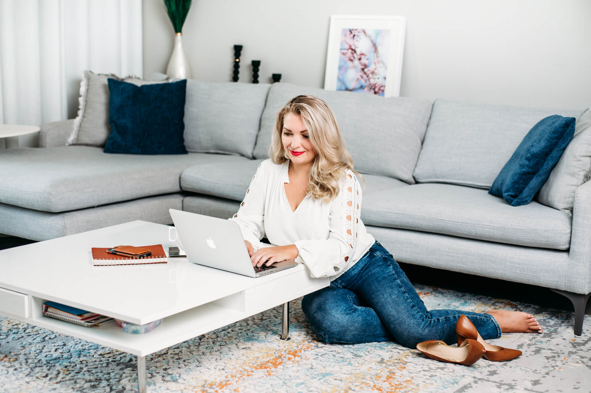 Lifestyle headshot of the women working on her laptop in living room