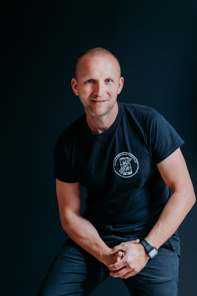 Headshot of Mobile services team member wearing company logo shirt