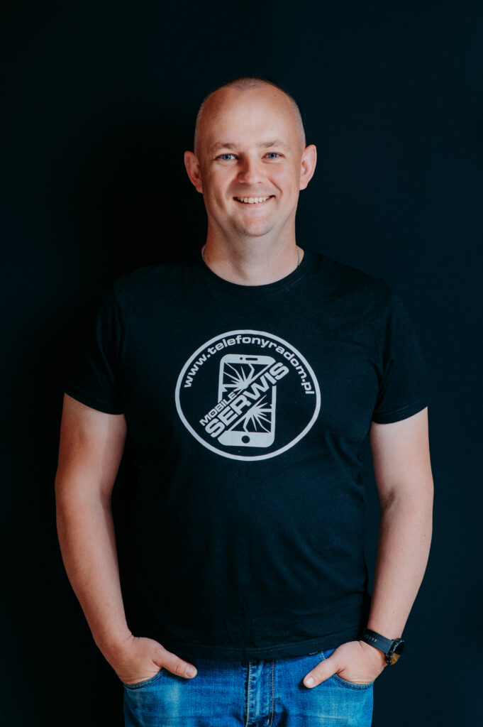 Headshot of Mobile services team member wearing company logo shirt