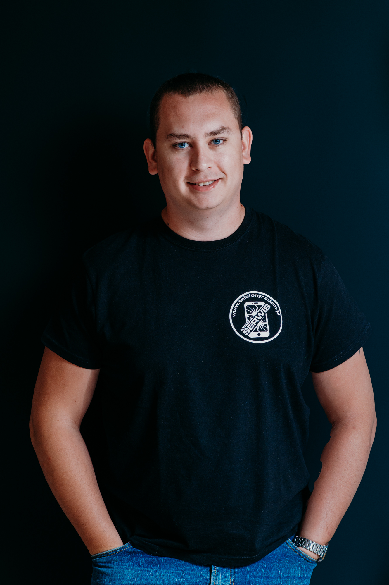 Headshot of Mobile services team member wearing company logo shirt