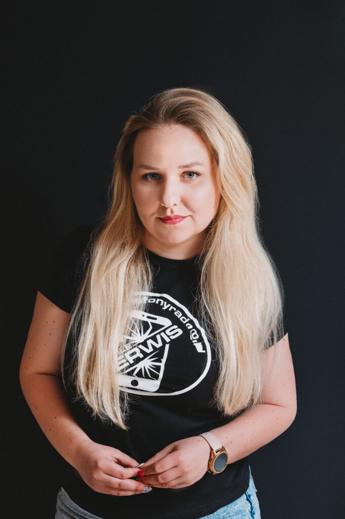 Headshot of Mobile services team member wearing company logo shirt