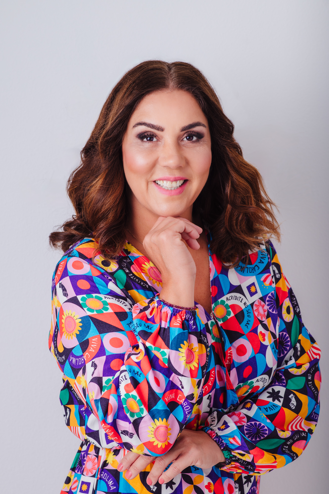 A woman in a colorful dress posing for a Sarasota personal branding photography session.