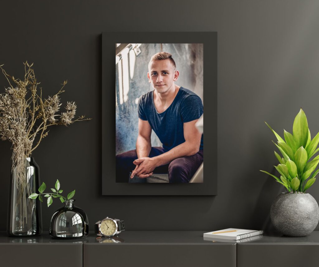 A professionally captured framed photo of a distinguished man sitting on a table, taken by a skilled Sarasota photographer.