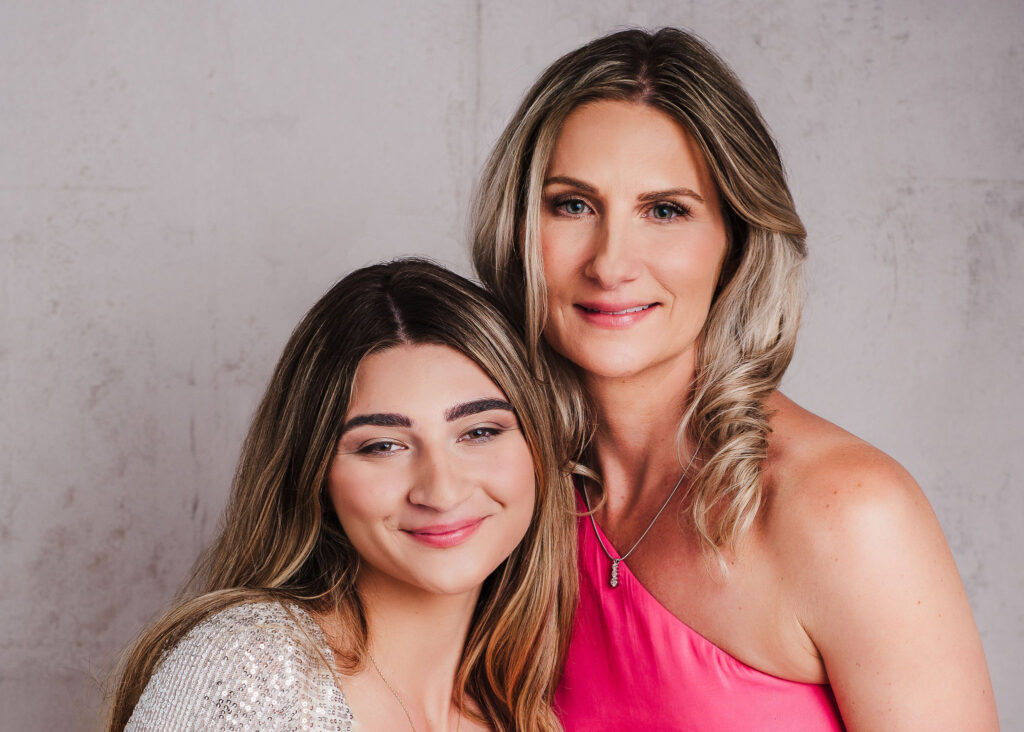 mother daughter portrait smiling and looking straight into camera