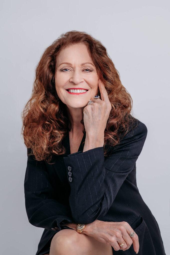 Commercial headshot of women smiling into camera